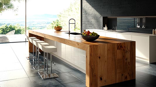 A kitchen island with a bar function - the perfect solution for those who enjoy social entertainment